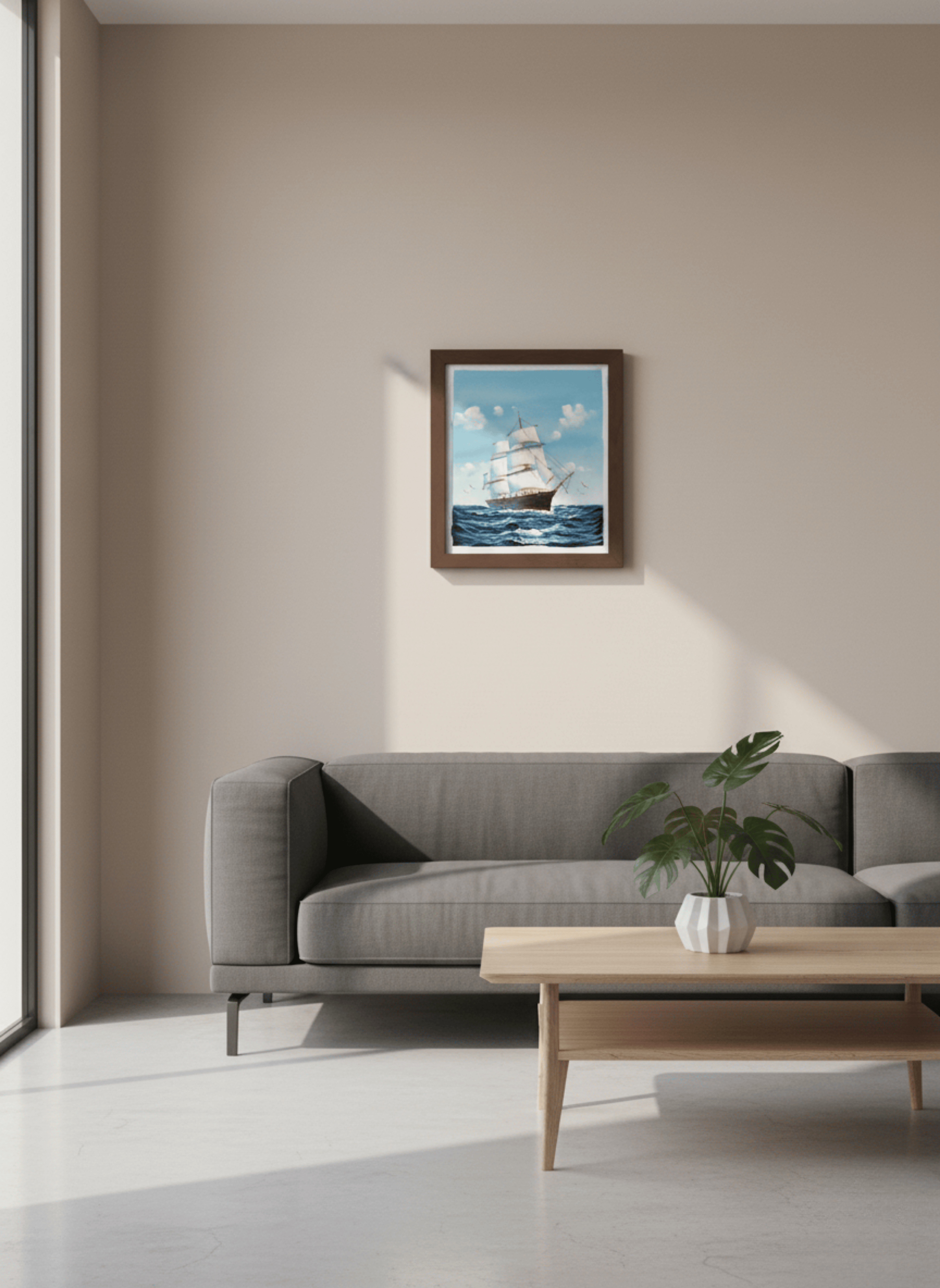 Living room with a gray sofa, wooden coffee table, and framed artwork of a ship on the wall.