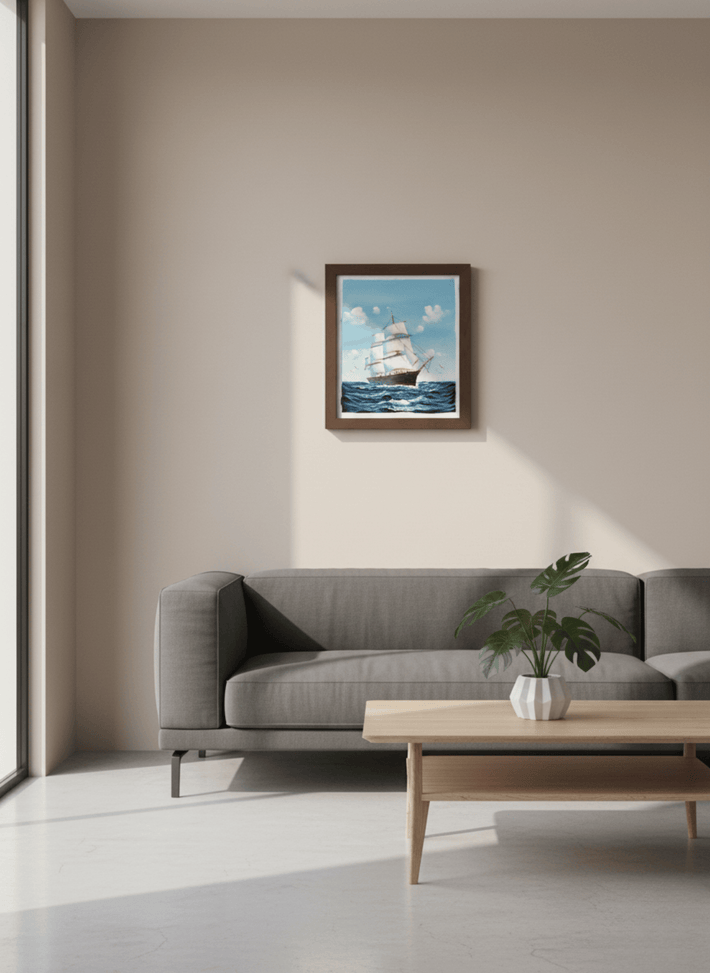 Living room with a gray sofa, wooden coffee table, and framed artwork of a ship on the wall.