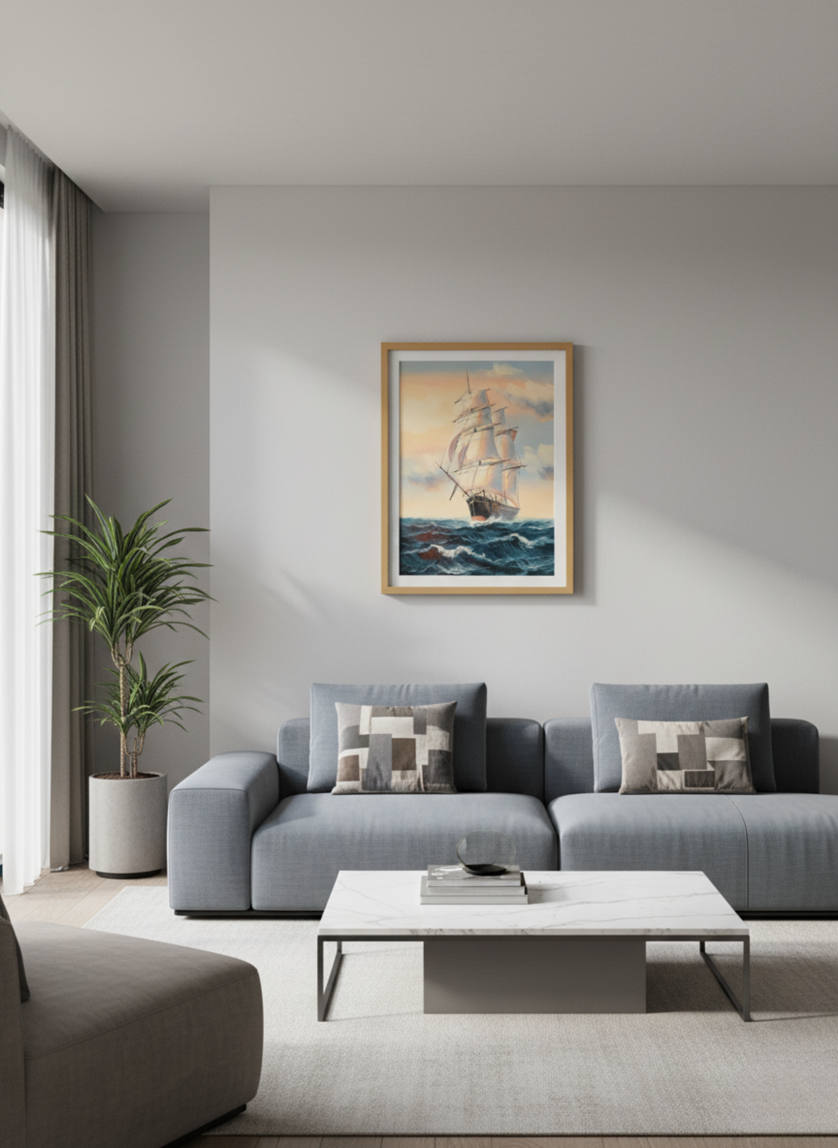 Modern living room with a gray sofa, coffee table, and framed artwork on the wall.