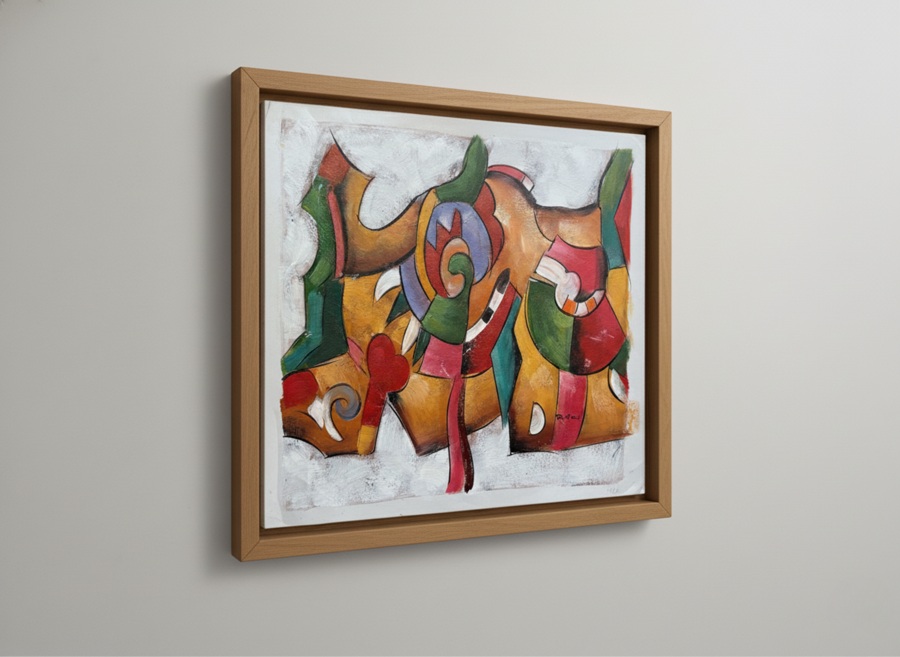Abstract colorful painting in a wooden frame on a plain wall