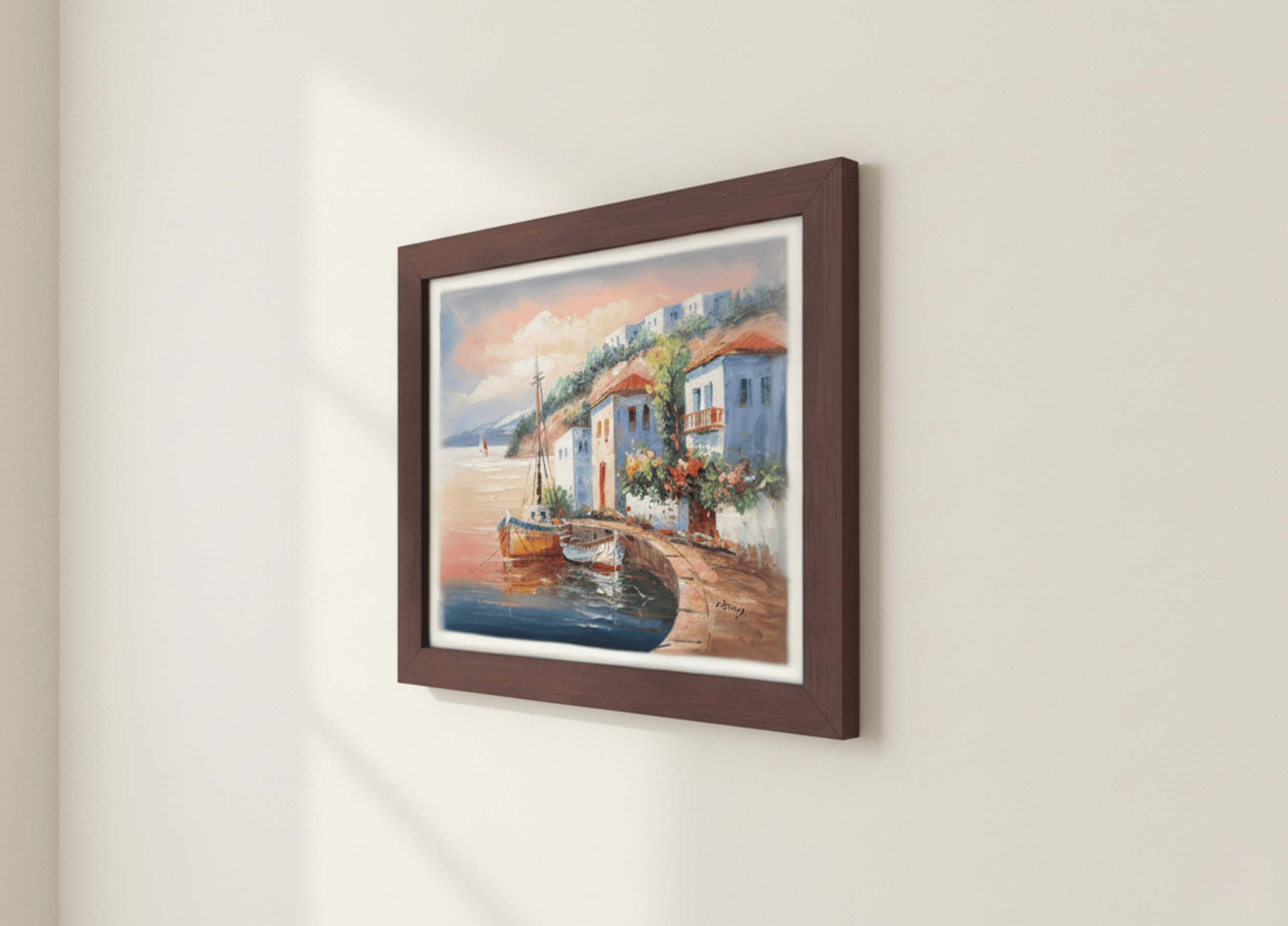 Framed painting of a coastal scene with houses and a boat on a white wall.