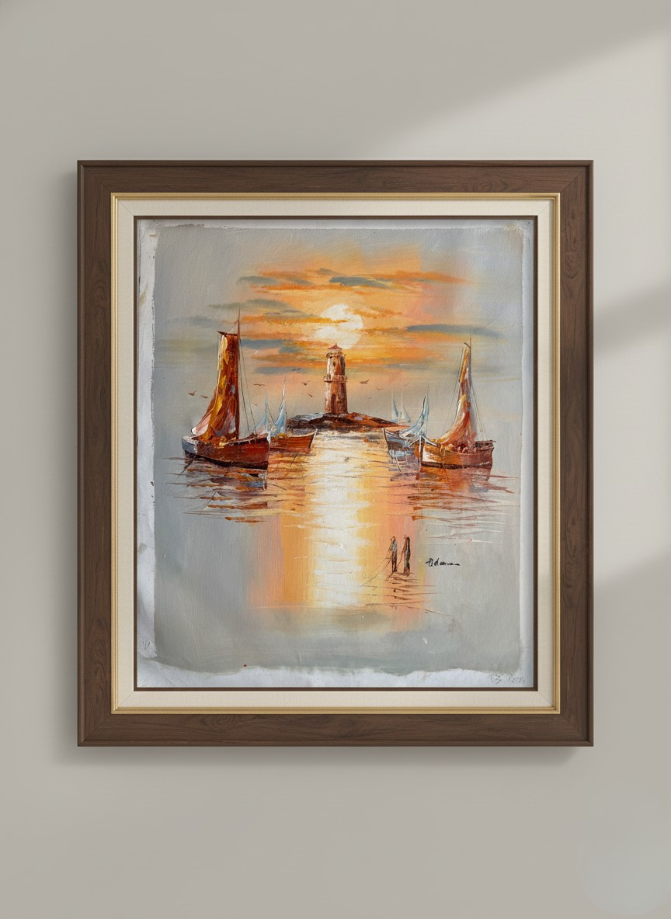 Framed painting of a lighthouse and boats at sunset on a wall.