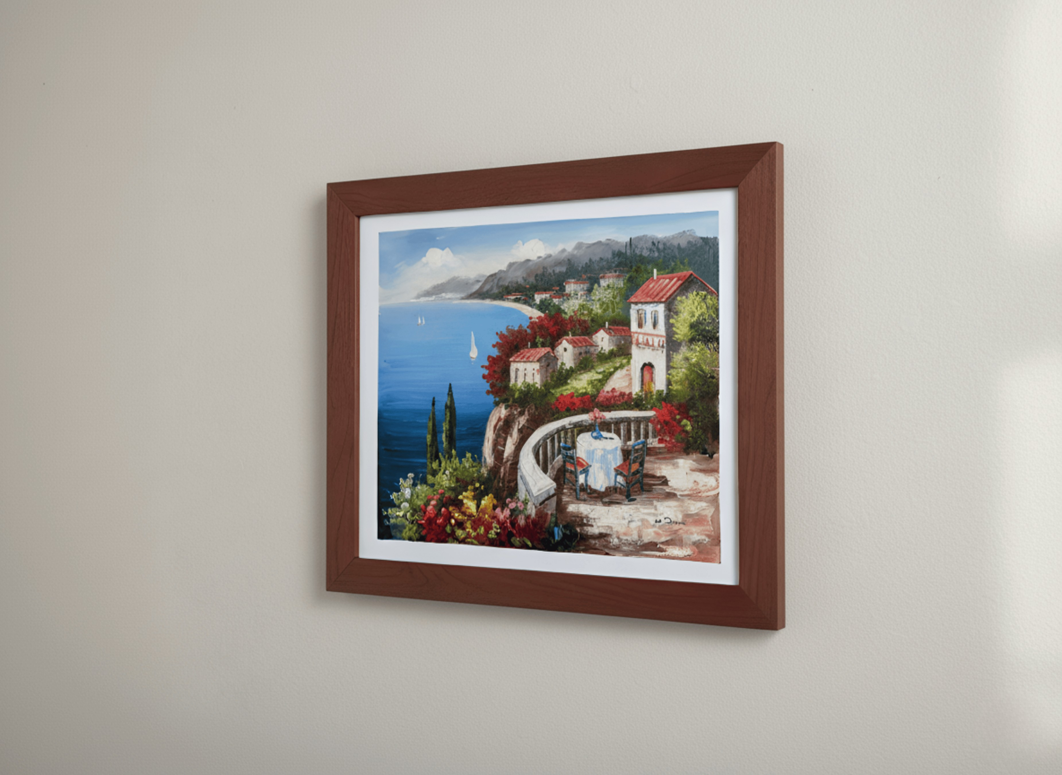 Framed artwork of a coastal scene with a house and ocean on a beige wall.