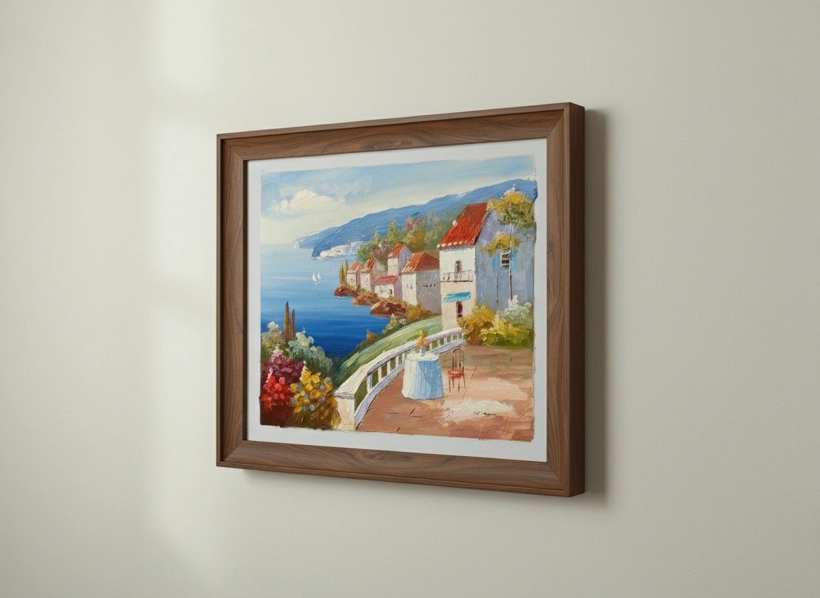 Framed painting of a coastal scene with houses and a woman on a path.