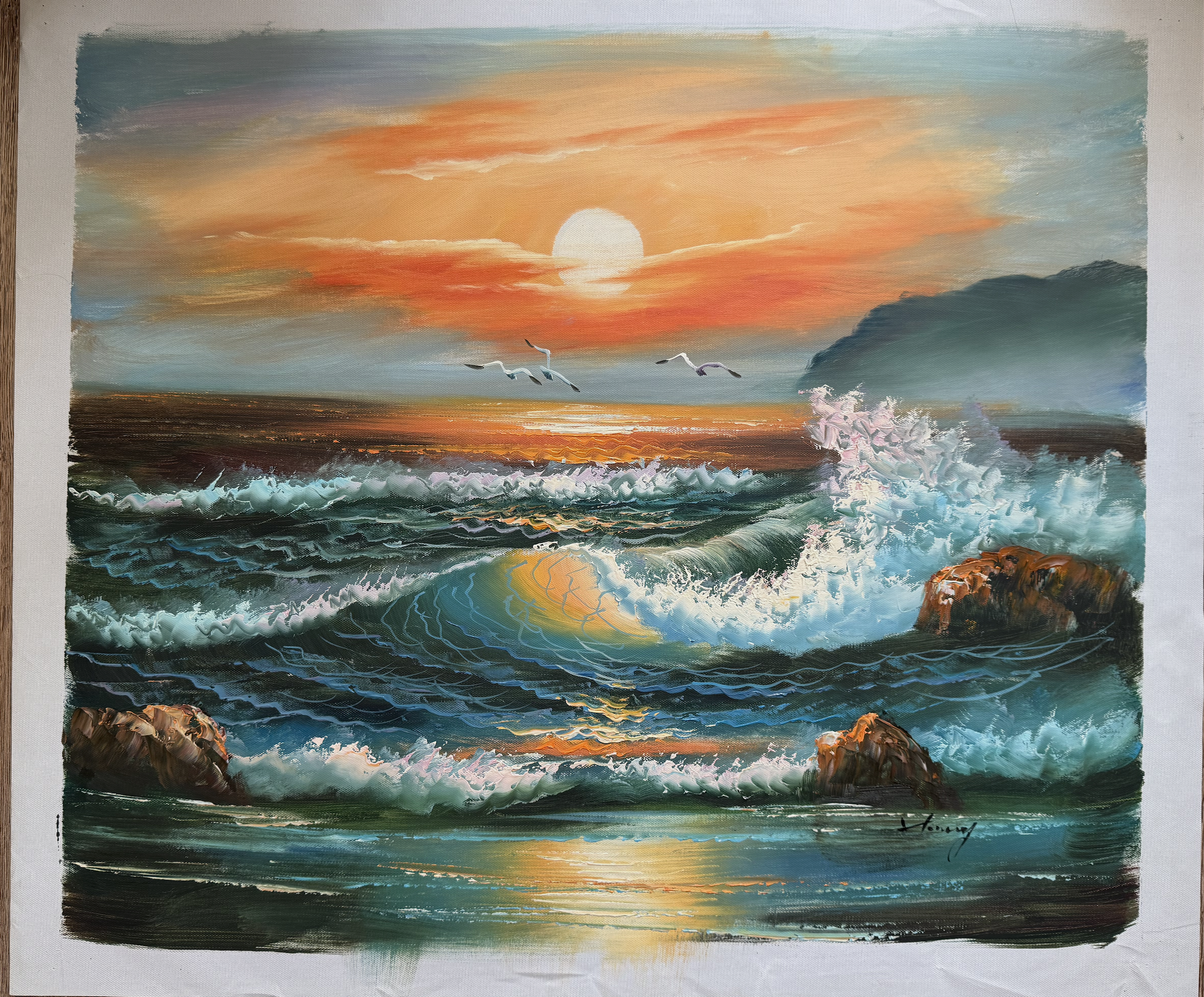 Painting of a sunset over the ocean with waves and rocks.